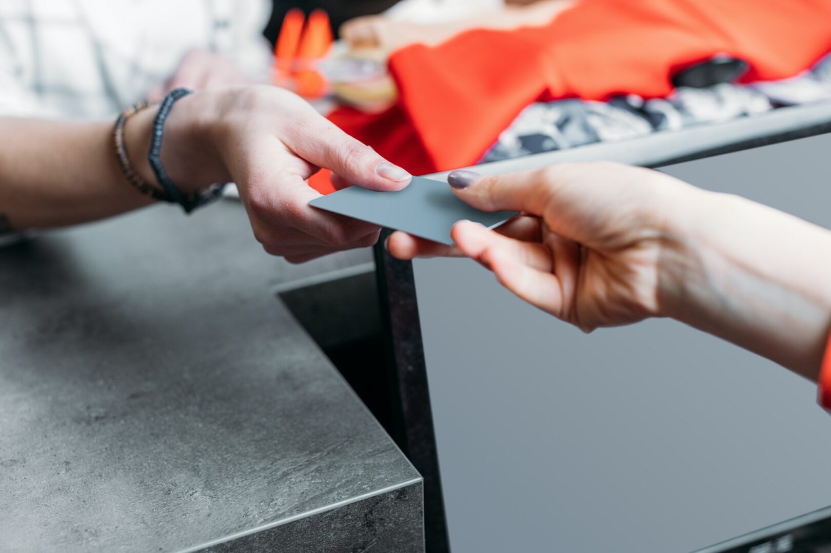 girl shopping and paying with credit card in shopping mall, boutique shopping concept